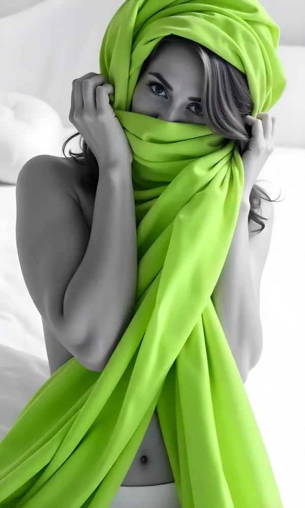 Caucasian Woman Age 25 With Brown Hair Partially Covered By A Vibrant Green Fabric In A Minimalist Gray And White Indoor Setting 14 1e49