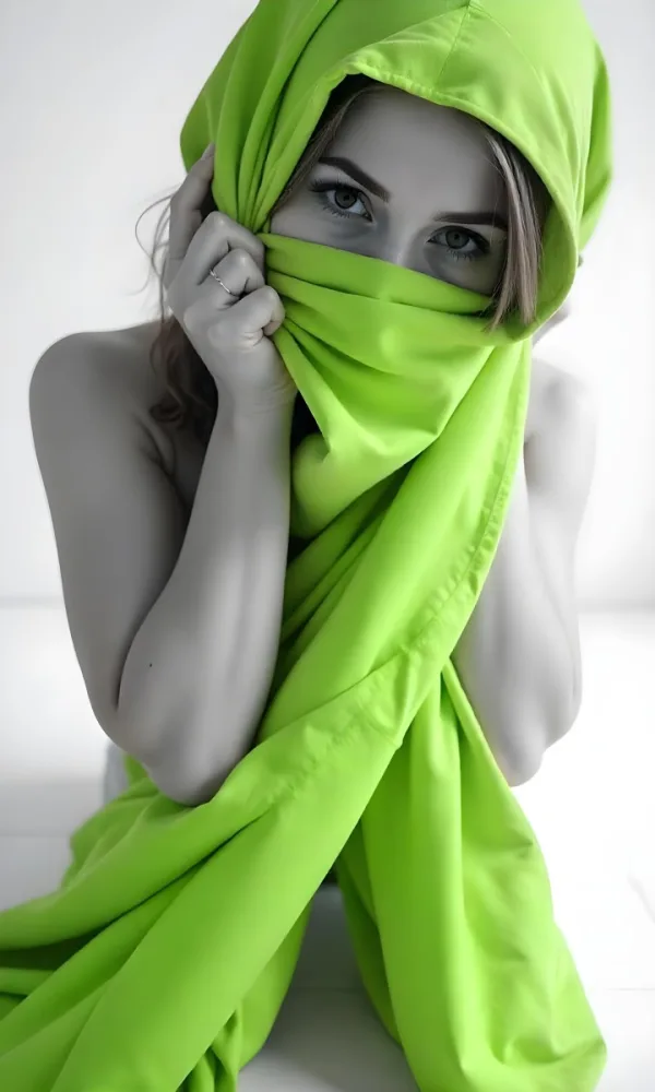 Caucasian Woman Age 25 With Brown Hair Partially Covered By A Vibrant Green Fabric In A Minimalist Gray And White Indoor Setting 4 7527