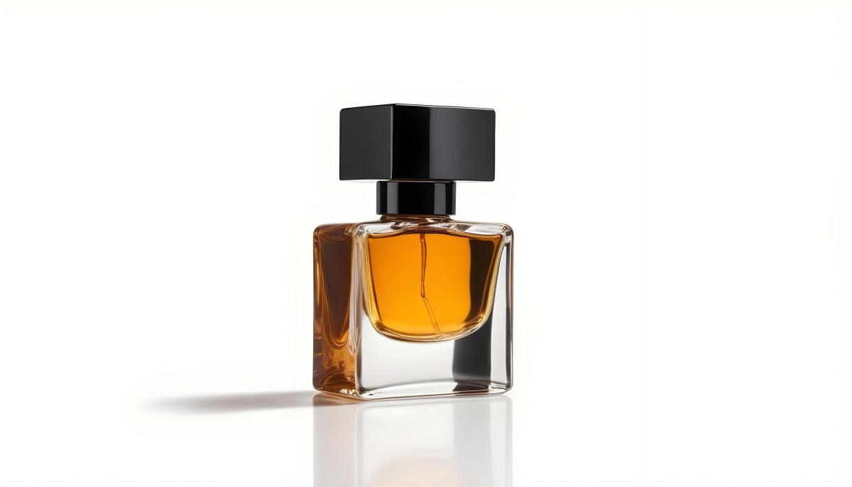 Minimal Soft Studio Light Photography A Glass Perfume Bottle With A Black Cap Filled With Amber Colored Liquid High Detail Solid Bold Color Background 22 6035