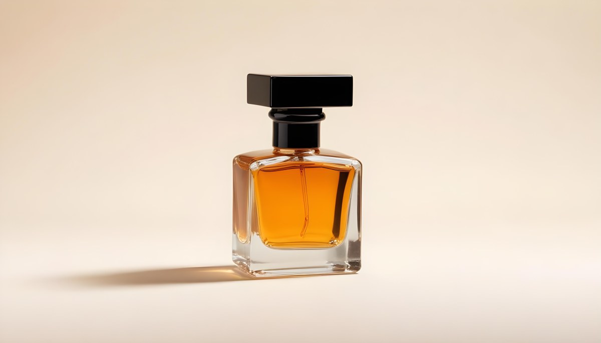Minimal Soft Studio Light Photography A Glass Perfume Bottle With A Black Cap Filled With Amber Colored Liquid High Detail Solid Bold Color Background 6 Eccf
