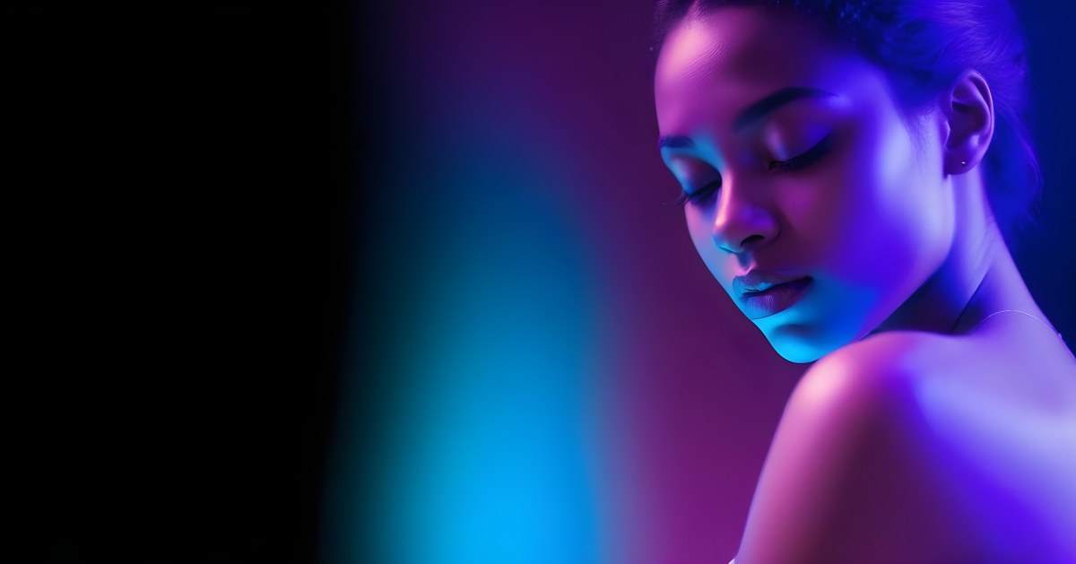 Minimal Soft Studio Light Photography A White Woman 23 Years Old With Dark Skin And Her Eyes Closed In A Dark Background With Blue And Purple Lights High Detail Solid Bold Color Background 8 566a