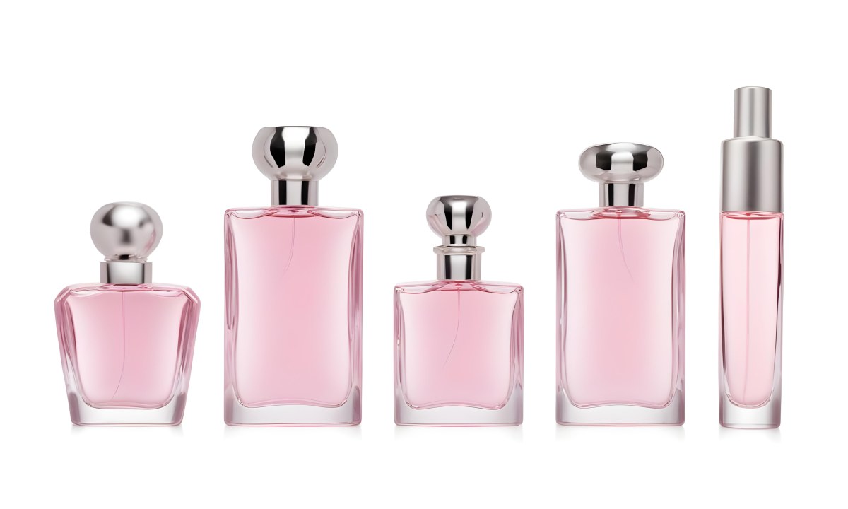 Minimal Soft Studio Light Photography Four Silver Perfume Bottles With Pink Caps Different Shapes And Sizes Arranged In A Row Clean And Minimalist Design Pink Background Elegant And Modern High Detail Solid Bold 30 7c56