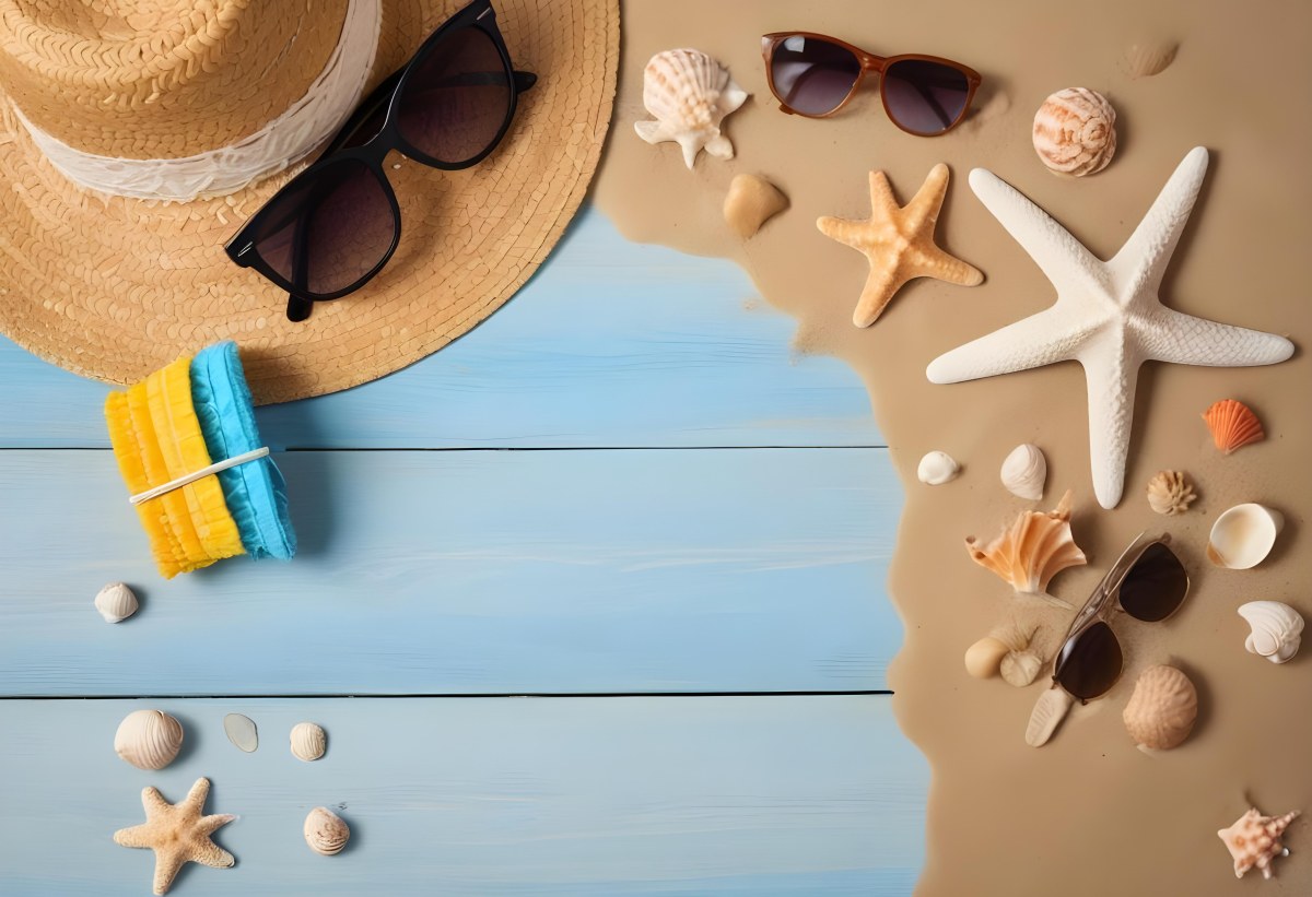 Straw Hat And Sunglasses Next To Seashells And A Starfish On A Sandy Beach With A Blue Wooden Surface In The Background 17 2212