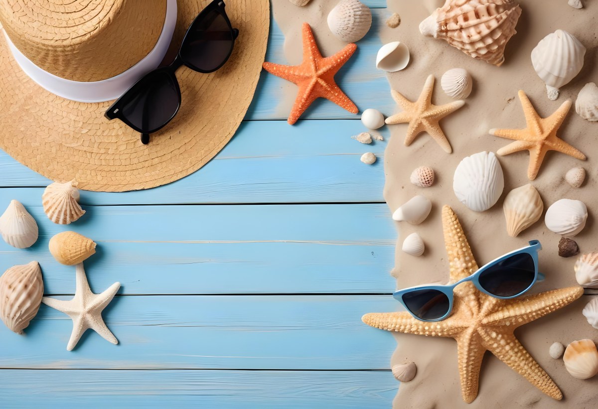 Straw Hat And Sunglasses Next To Seashells And A Starfish On A Sandy Beach With A Blue Wooden Surface In The Background 7 6326