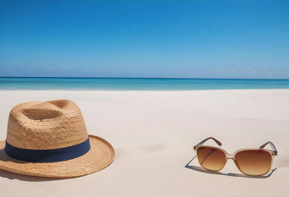 Straw Hat And Sunglasses On A White Sand Beach With A Clear Blue Sky And Ocean In The Background 36 Fee3