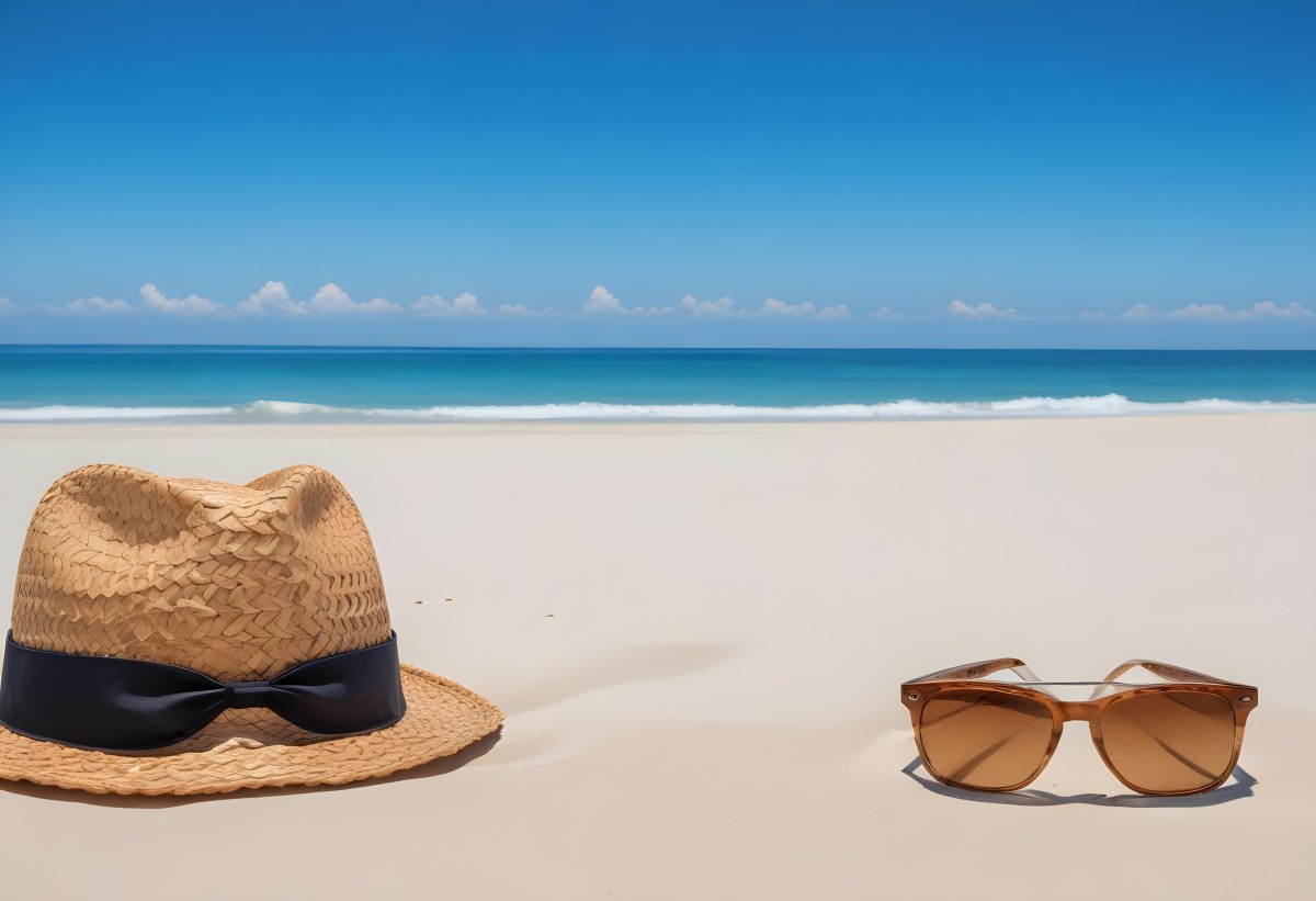 Straw Hat And Sunglasses On A White Sand Beach With A Clear Blue Sky And Ocean In The Background 4 5aca
