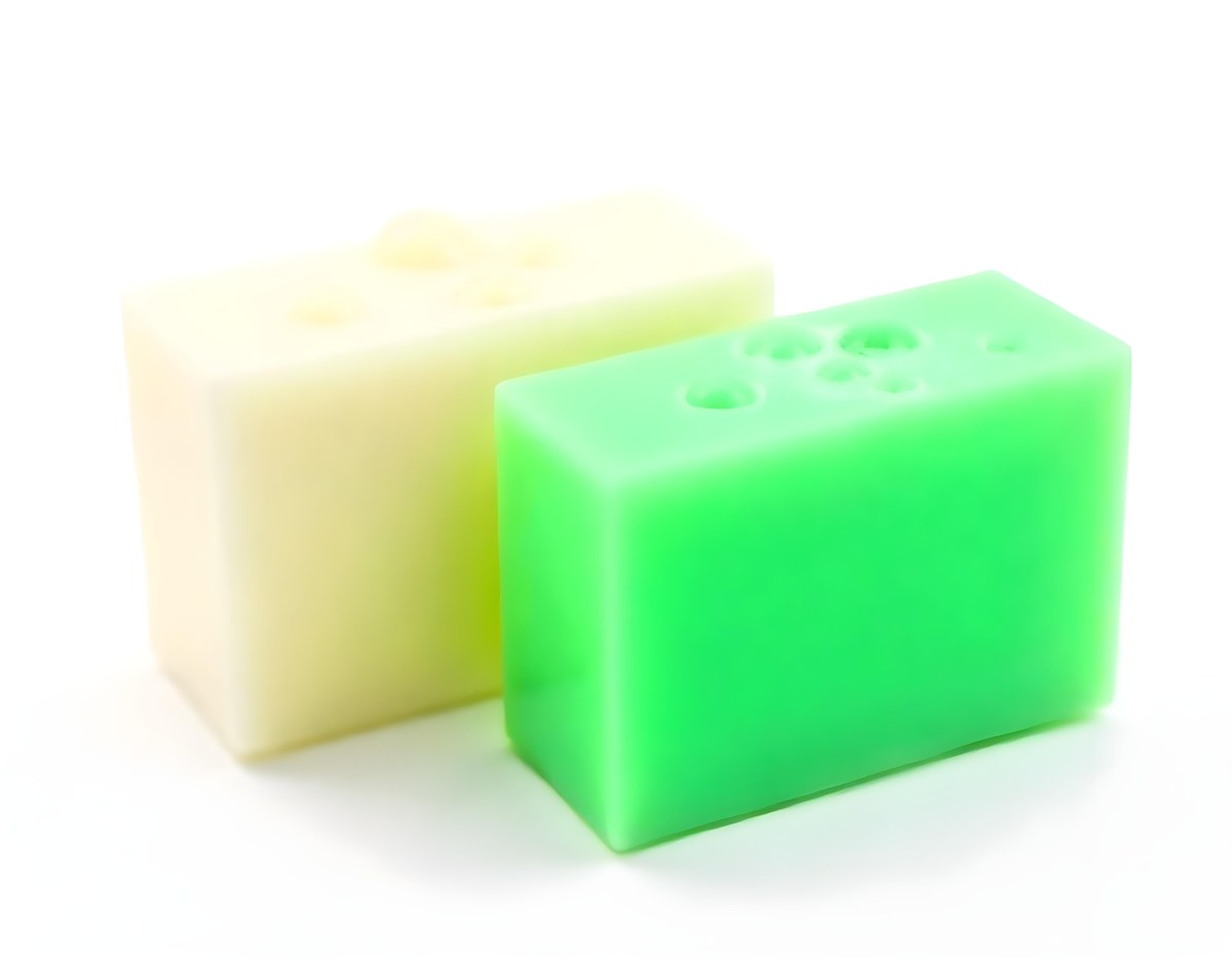 Two Bars Of Soap One White And One Green With Bubbles On Top In A White Background 12 B41d