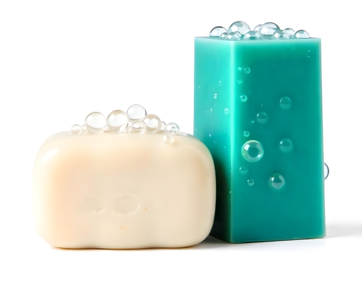 Two Bars Of Soap One White And One Green With Bubbles On Top In A White Background 23 4867