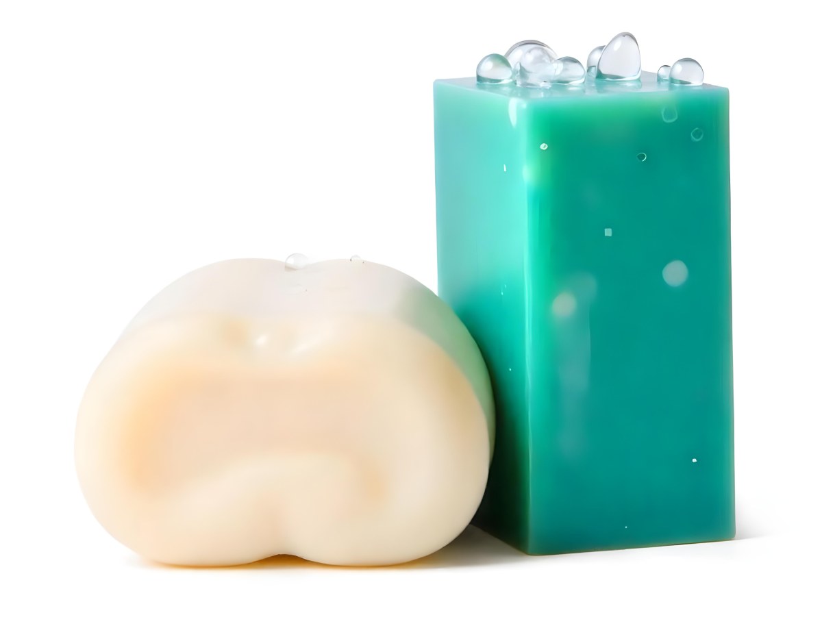 Two Bars Of Soap One White And One Green With Bubbles On Top In A White Background 6 6d1b