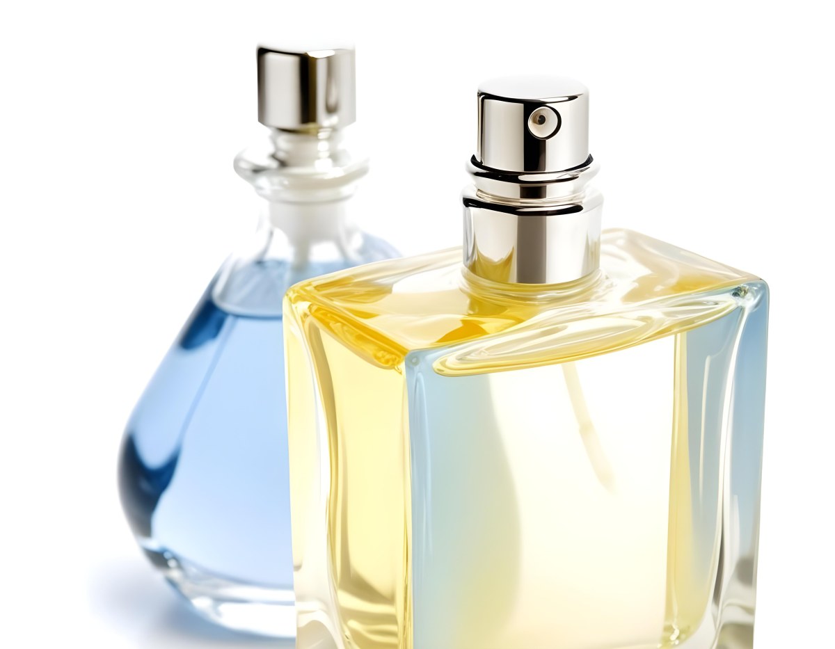 Two Perfume Bottles One With A Blue Liquid And The Other With A White Liquid White Background 32 81e3