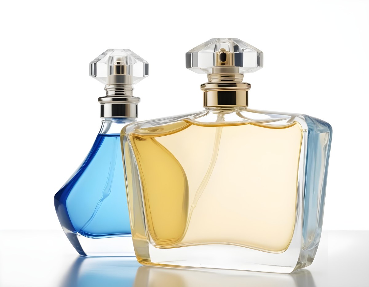 Two Perfume Bottles One With A Blue Liquid And The Other With A White Liquid White Background 37 4927