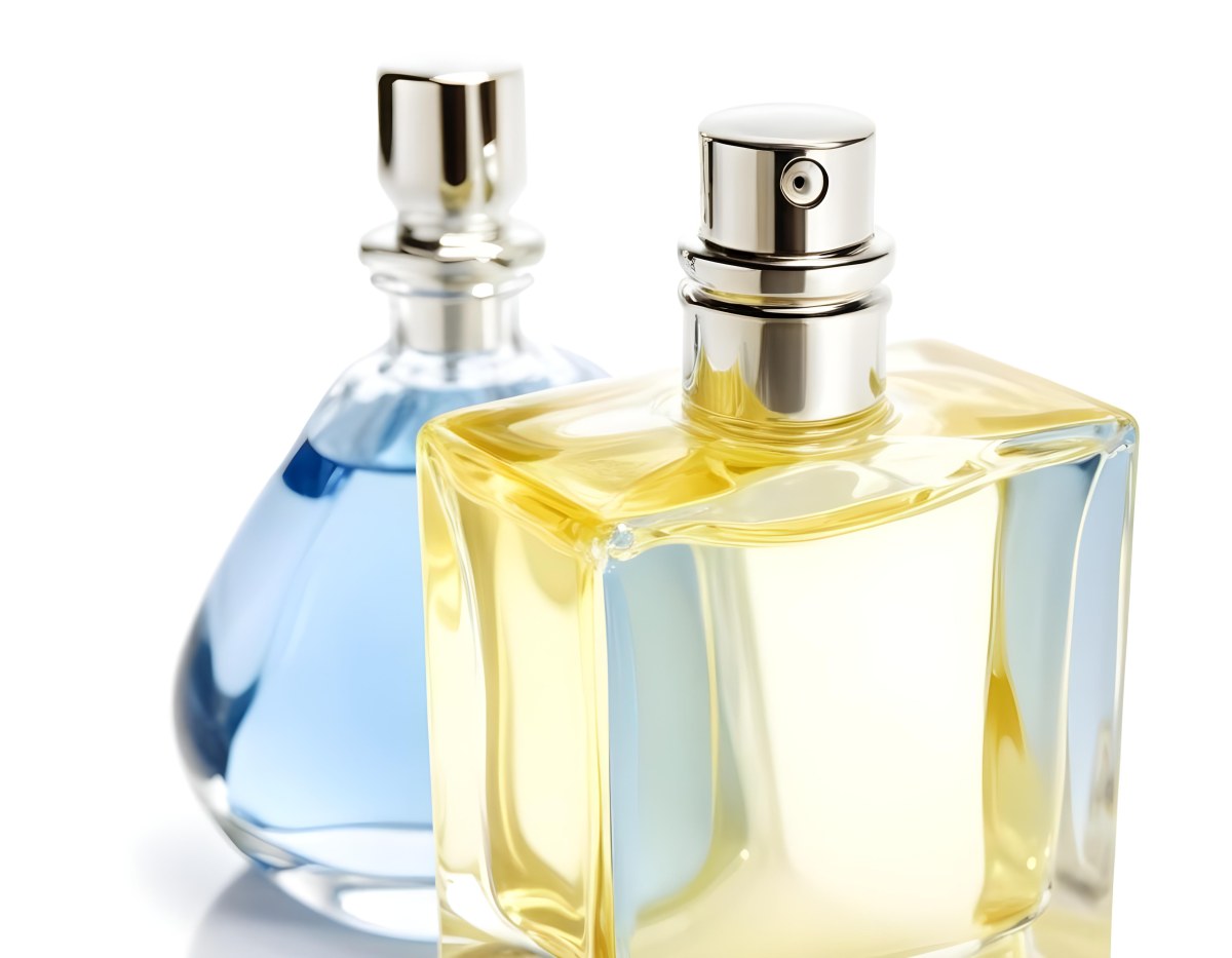 Two Perfume Bottles One With A Blue Liquid And The Other With A White Liquid White Background 7 Af21