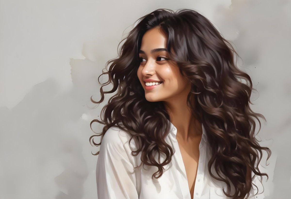 Young Woman Of South Asian Descent With Long Curly Dark Brown Hair Smiling Softly She Is Wearing A White Blouse And Has A Light Background 20 A98c