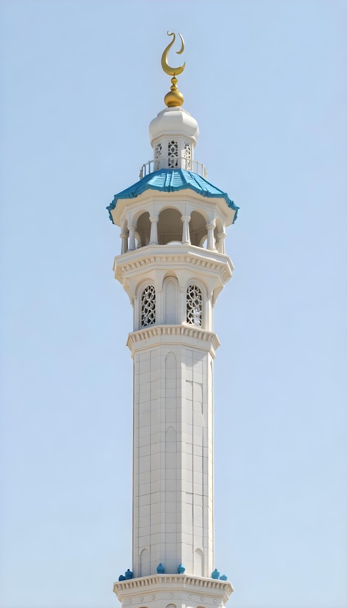 A Tall White Minaret With Blue Roof And Intricate Details Against A Clear Blue Sky Showcasing Islamic Architecture And Design 2 96fd