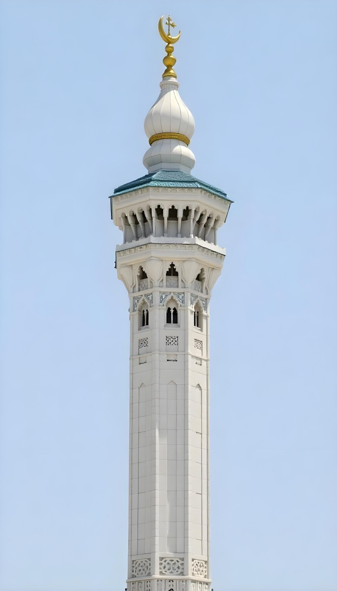 A Tall White Minaret With Blue Roof And Intricate Details Against A Clear Blue Sky Showcasing Islamic Architecture And Design 37 Df76