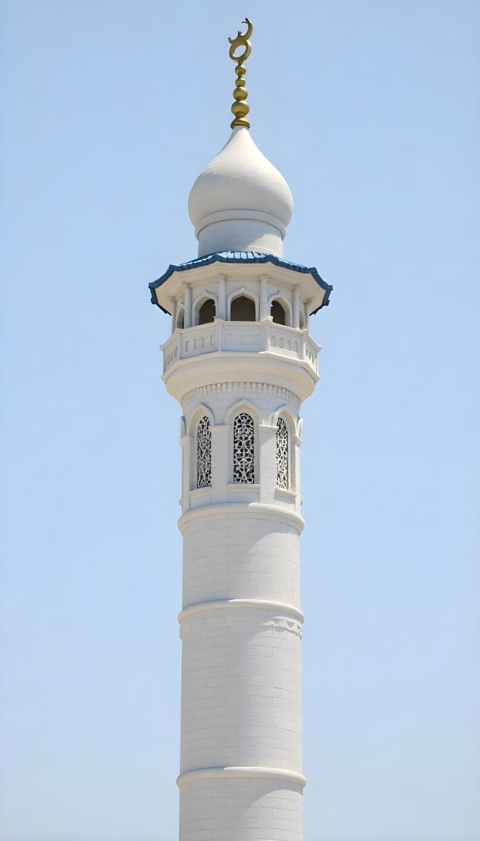 A Tall White Minaret With Blue Roof And Intricate Details Against A Clear Blue Sky Showcasing Islamic Architecture And Design 8 4f5c
