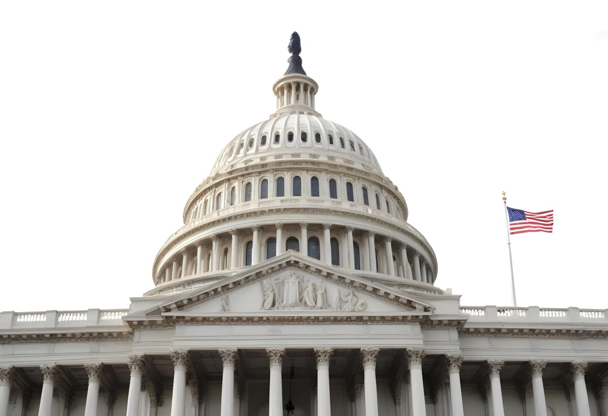 The United States Capitol Building With The American Flag Waving In The Wind The Sky Is White 24 C29e