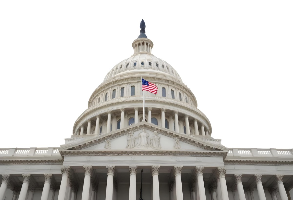 The United States Capitol Building With The American Flag Waving In The Wind The Sky Is White 5 97b3