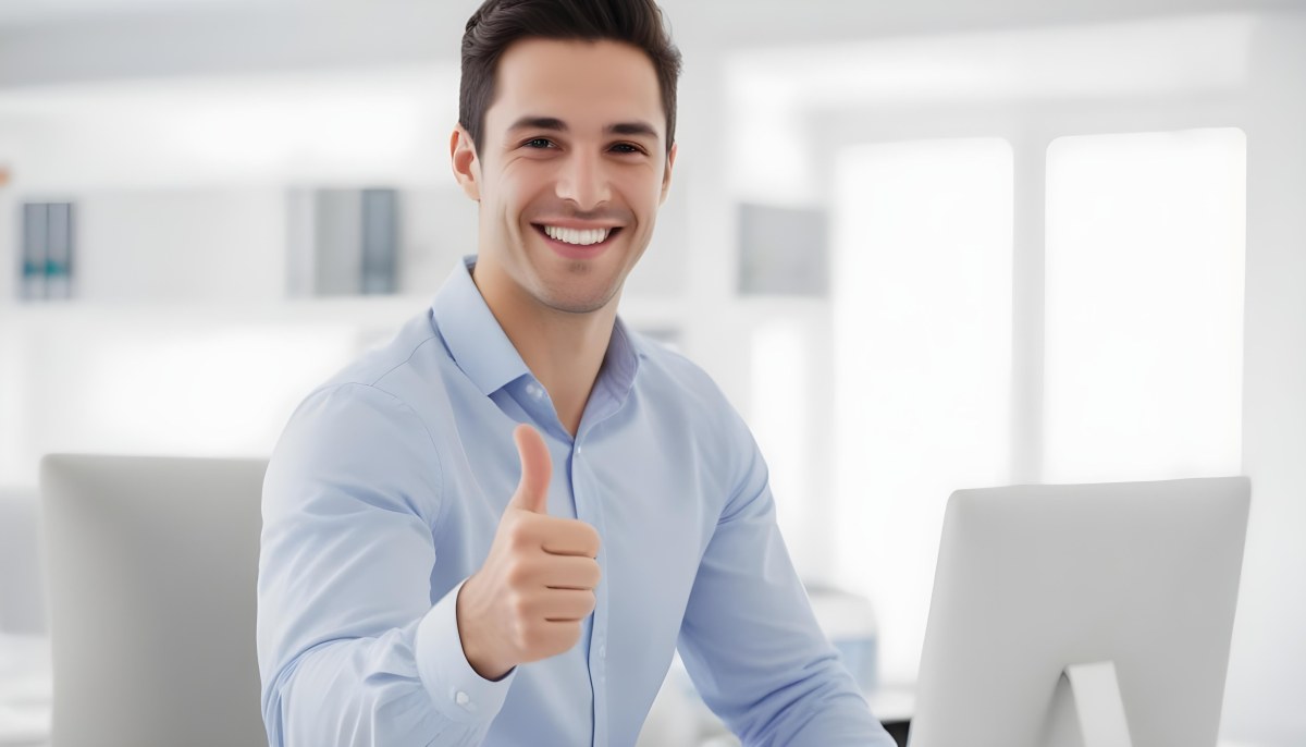 A Caucasian Man 28 Years Old Dark Hair Smiling And Doing A Thumbs Up In A Bright Office 30 Eac6
