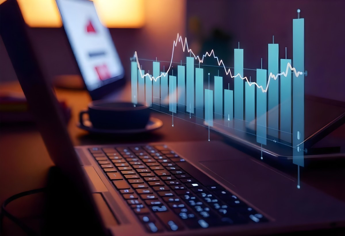 A Laptop With A Keyboard And A Screen Displaying Financial Data With A Bar Graph Overlayed On Top In An Office Environment 34 A5a5