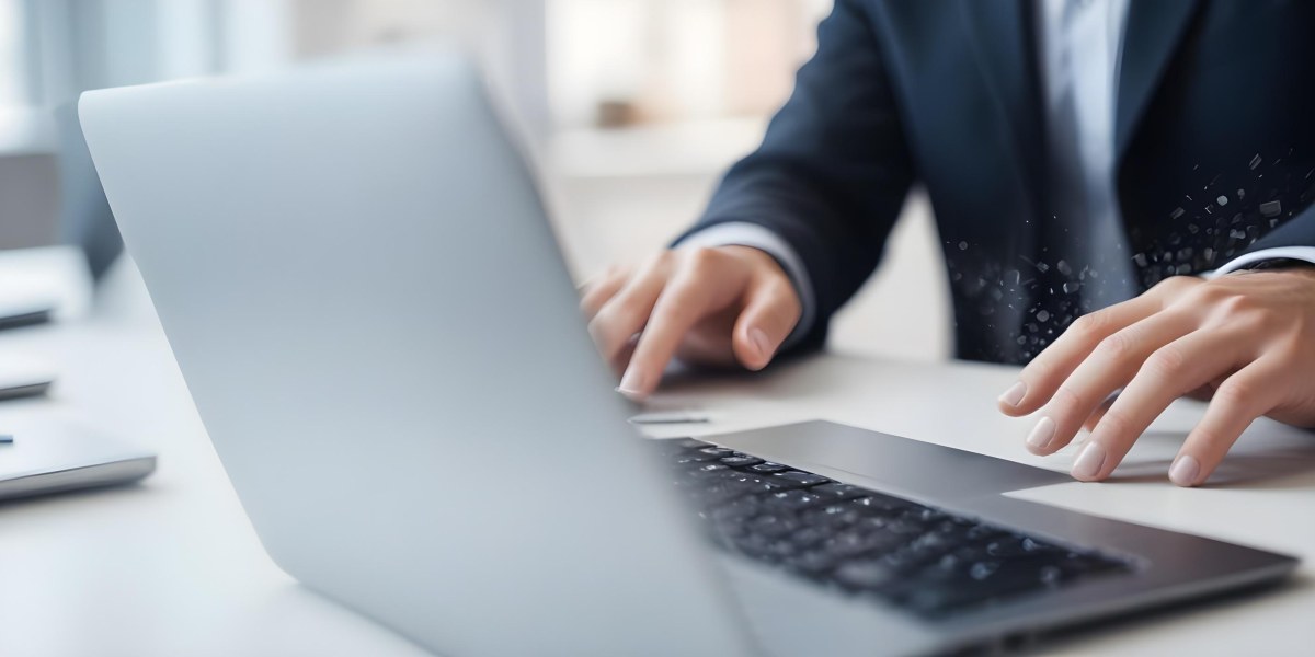 A Person S Hands Typing On A Laptop Keyboard In A Blurred Office Environment 7 0497