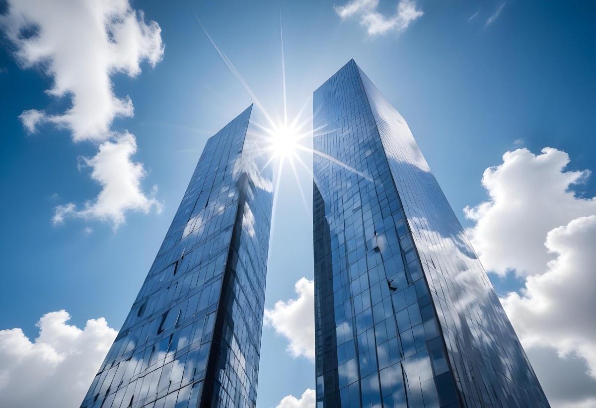 Low Angle Shot Of A Modern Glass Skyscraper Reflecting The Blue Sky And White Clouds Sun Shining Through The Clouds Creating A Bright And Airy Atmosphere 7 C5e4
