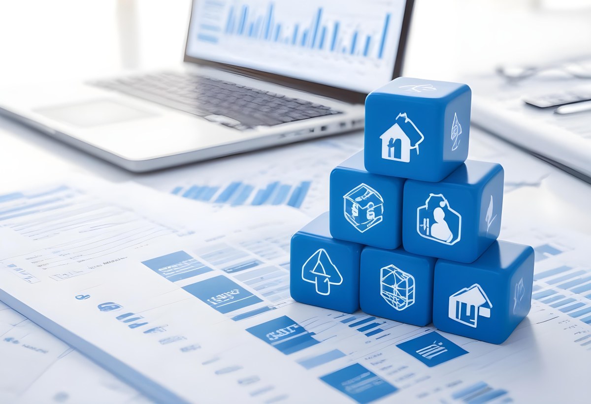 Stack Of Blue Cubes With Business Icons On Top Of A Financial Report With A Laptop In The Background 33 9002