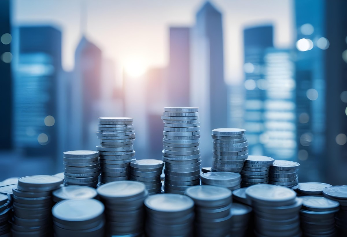 Stacks Of Coins Against A Blurred Cityscape Background Representing Financial Growth And Investment 13 873d