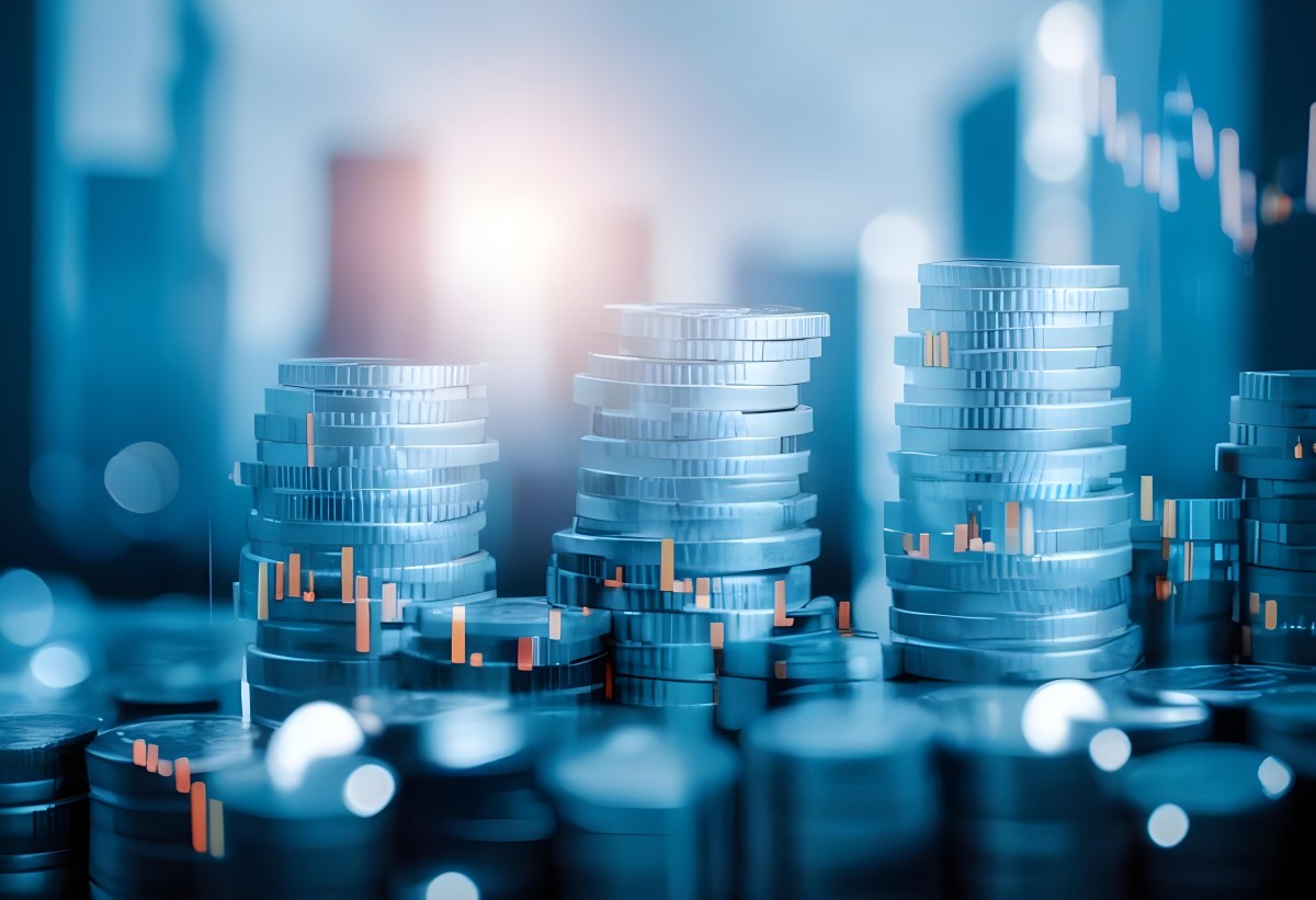 Stacks Of Coins Against A Blurred Cityscape Background Representing Financial Growth And Investment 14 37fd