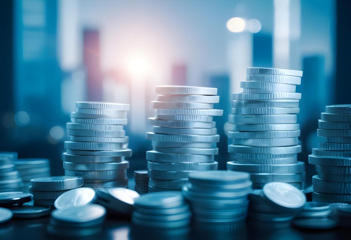 Stacks Of Coins Against A Blurred Cityscape Background Representing Financial Growth And Investment 8 57bf