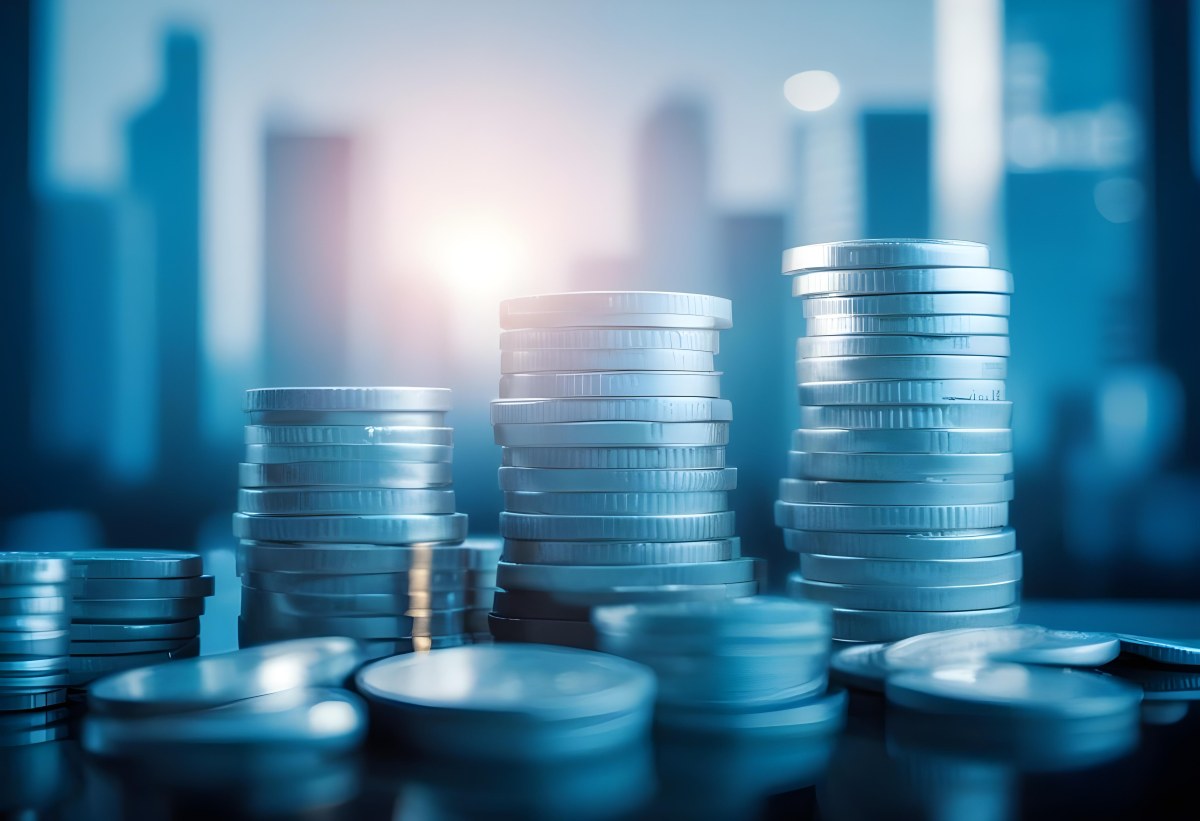 Stacks Of Coins Against A Blurred Cityscape Background Representing Financial Growth And Investment 9 C8aa