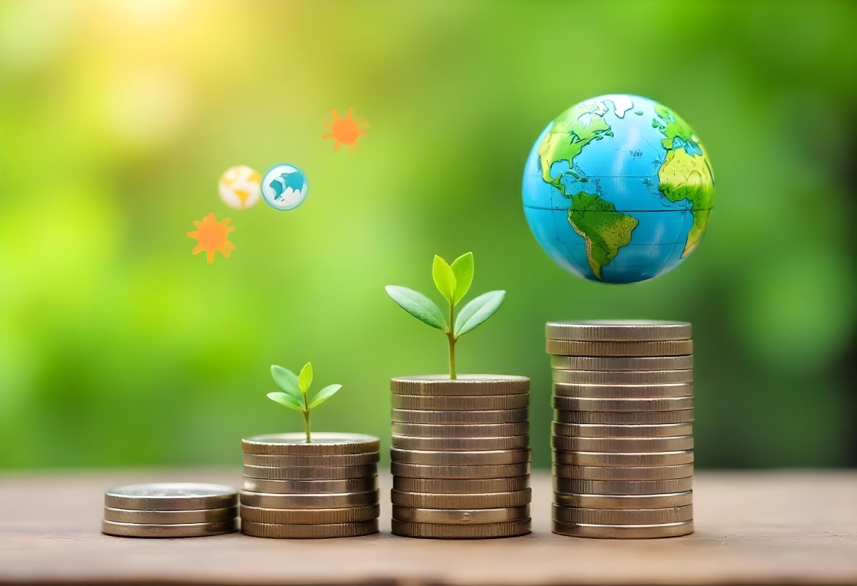Stacks Of Coins With Plants Growing On Top A Green Earth Globe And Environmental Icons Floating Above On A Wooden Surface With A Blurred Green Background 52 5630