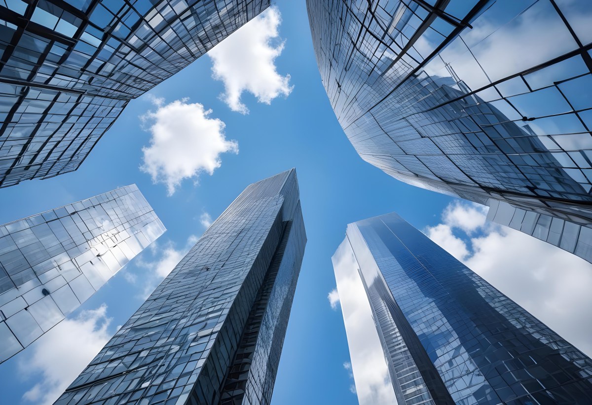 Worm S Eye View Of Modern Skyscrapers With Glass And Steel Facades Reaching Towards A Blue Sky With Scattered Clouds Creating A Sense Of Urban Grandeur 1 B033