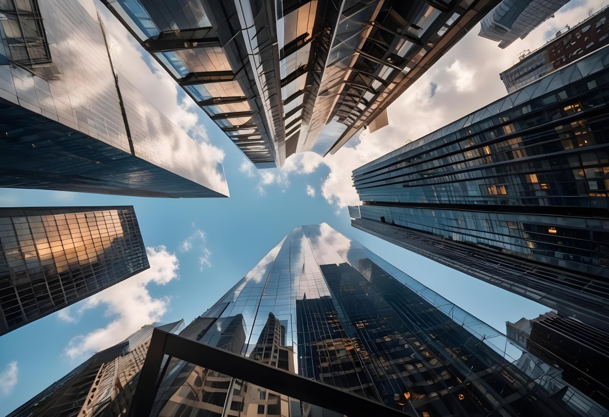 Worm S Eye View Of Modern Skyscrapers With Glass And Steel Facades Reaching Towards A Blue Sky With Scattered Clouds Creating A Sense Of Urban Grandeur 29 9bd0
