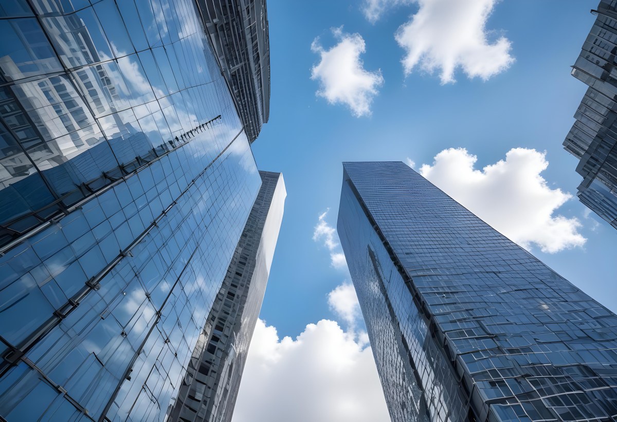 Worm S Eye View Of Modern Skyscrapers With Glass And Steel Facades Reaching Towards A Blue Sky With Scattered Clouds Creating A Sense Of Urban Grandeur 5 0460