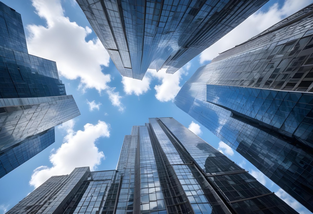 Worm S Eye View Of Modern Skyscrapers With Glass And Steel Facades Reaching Towards A Blue Sky With Scattered Clouds Creating A Sense Of Urban Grandeur 9 0095