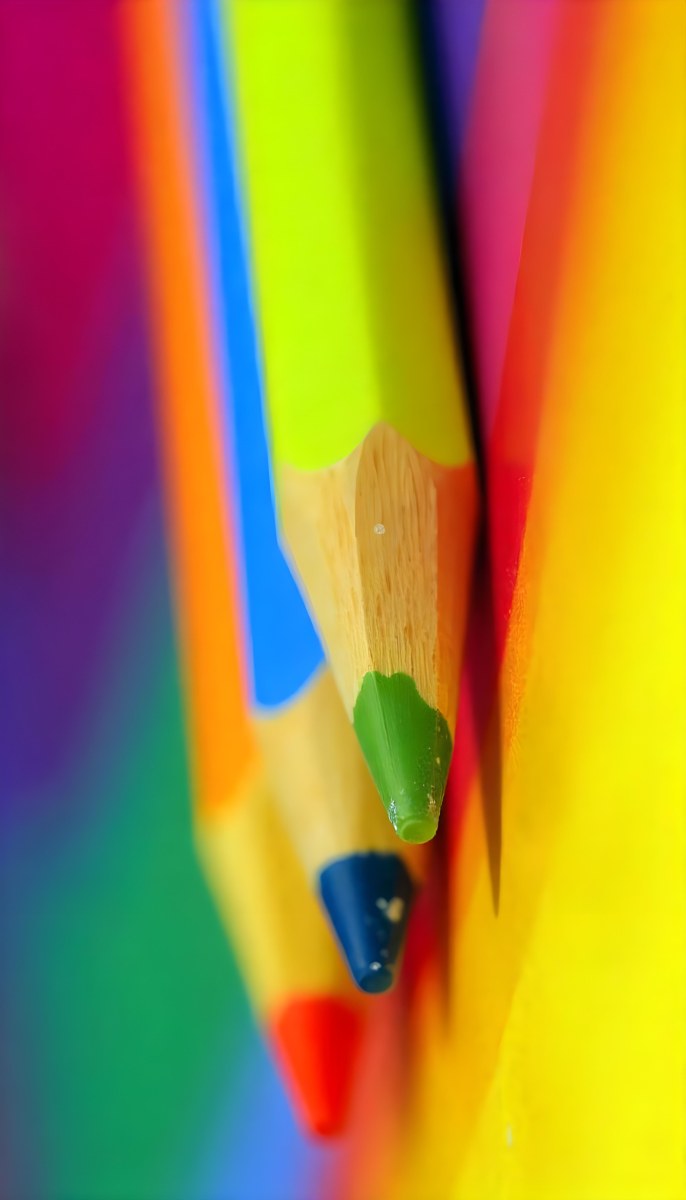A Close Up Of Colored Pencils With A Purple Tip The Background Is A Gradient Of Purple Blue Orange Yellow And Red 50 8b2d