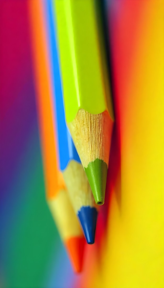 A Close Up Of Colored Pencils With A Purple Tip The Background Is A Gradient Of Purple Blue Orange Yellow And Red 52 8757