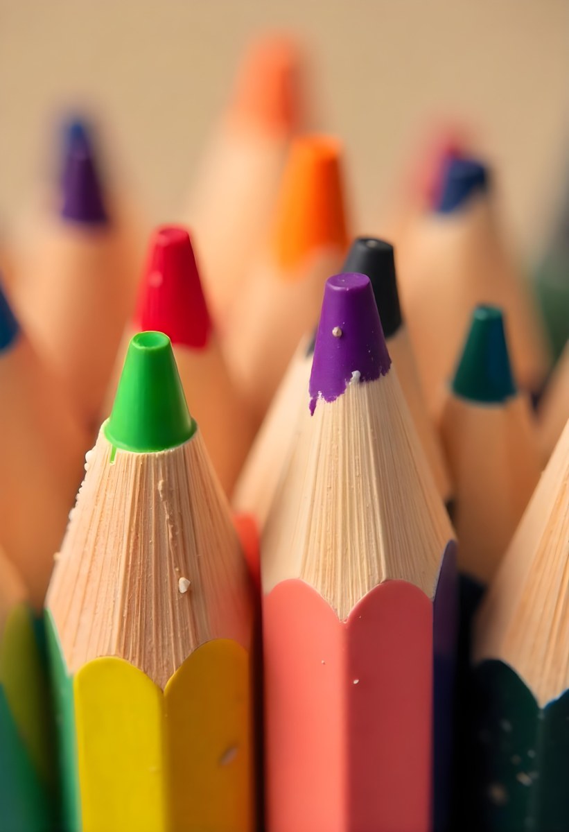 A Close Up Of Colored Pencils With A Purple Tip The Background Is A Gradient Of Purple Blue Orange Yellow And Red 8 4568
