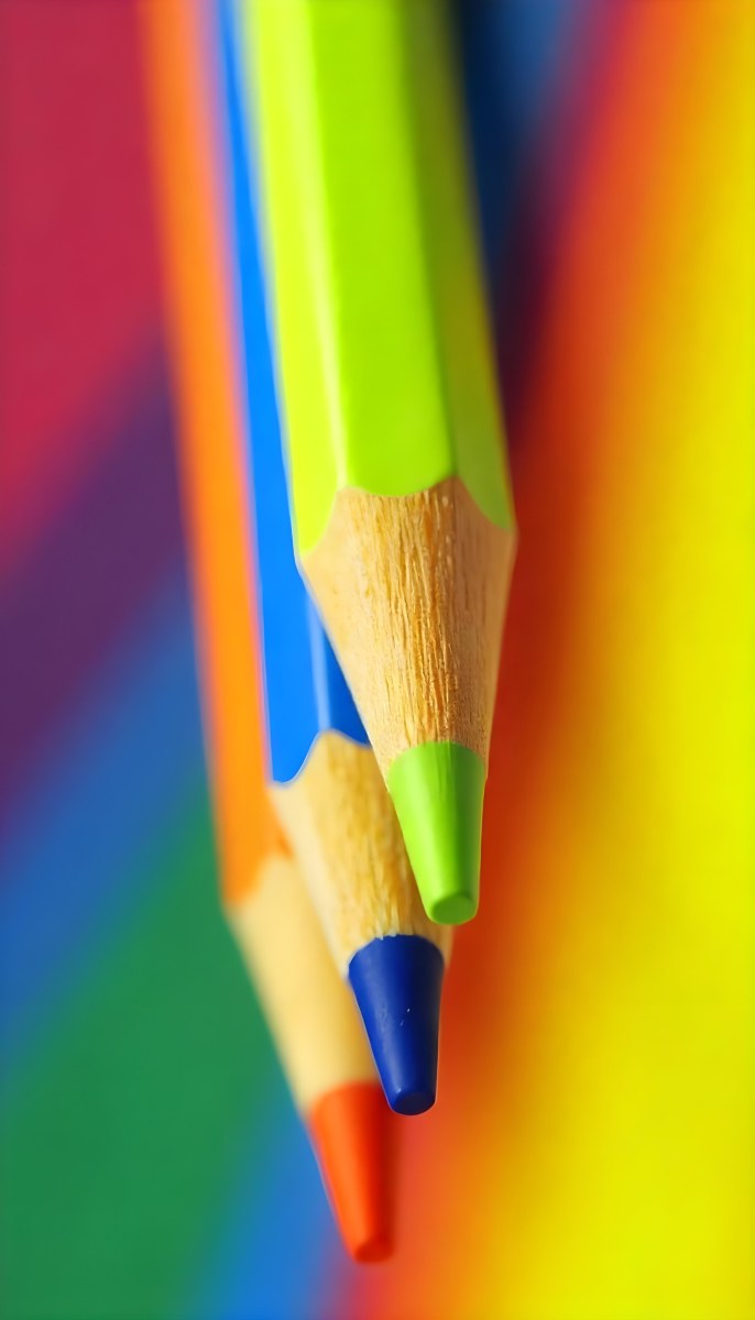 A Close Up Of Colored Pencils With A Purple Tip The Background Is A Gradient Of Purple Blue Orange Yellow And Red 9 D22a