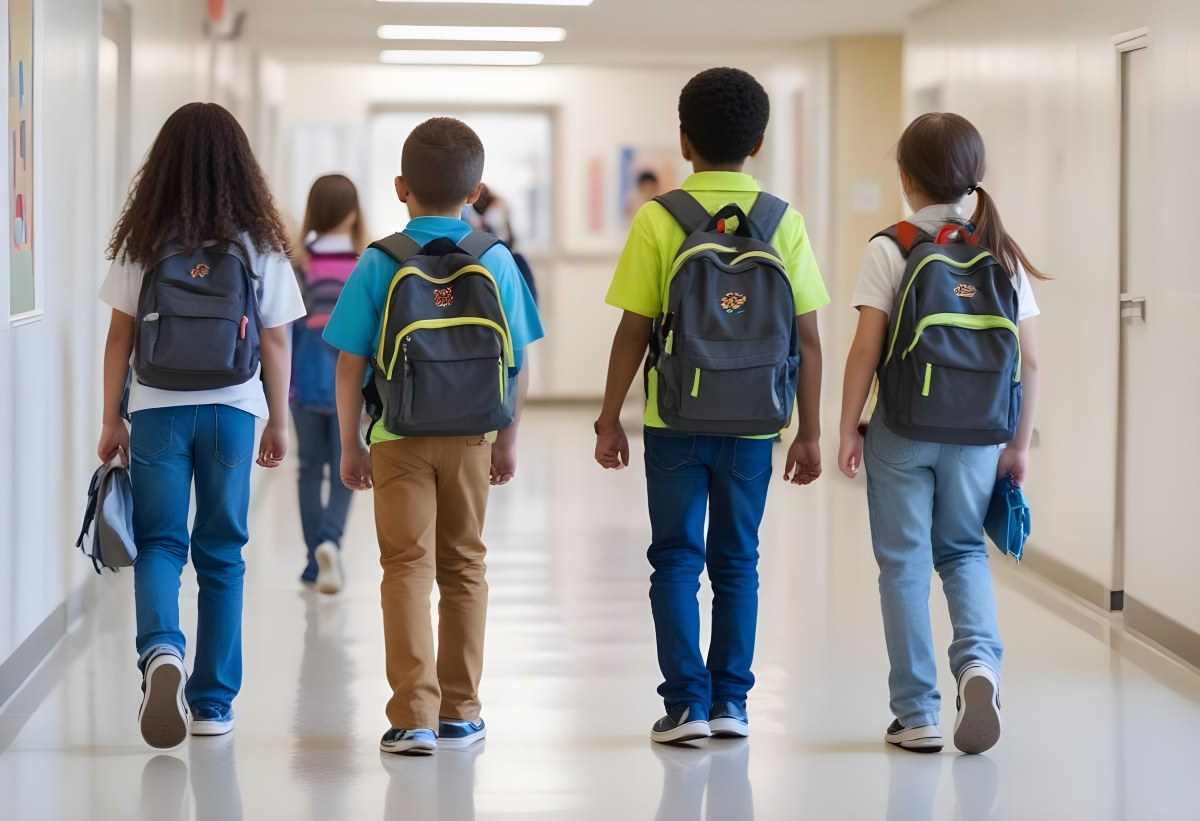 A Group Of Elementary School Students Walking Down A