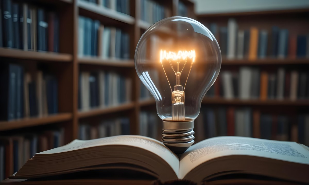 A Light Bulb On Top Of An Open Book Library In The Background With Many Books On The Shelves Warm Light Knowledge Concept 24 96ab