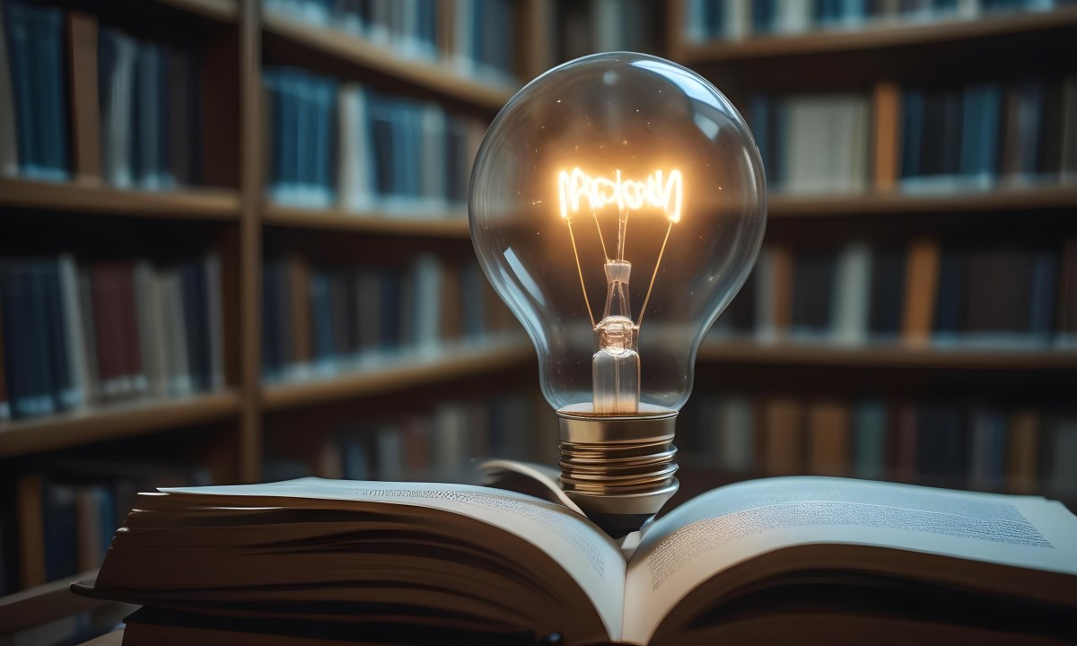 A Light Bulb On Top Of An Open Book Library In The Background With Many Books On The Shelves Warm Light Knowledge Concept 31 5287