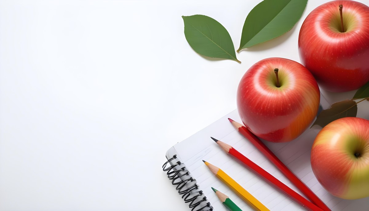 A Red Apple Pencils And A Notebook On A White Background With Green Leaves 5 Ab2a