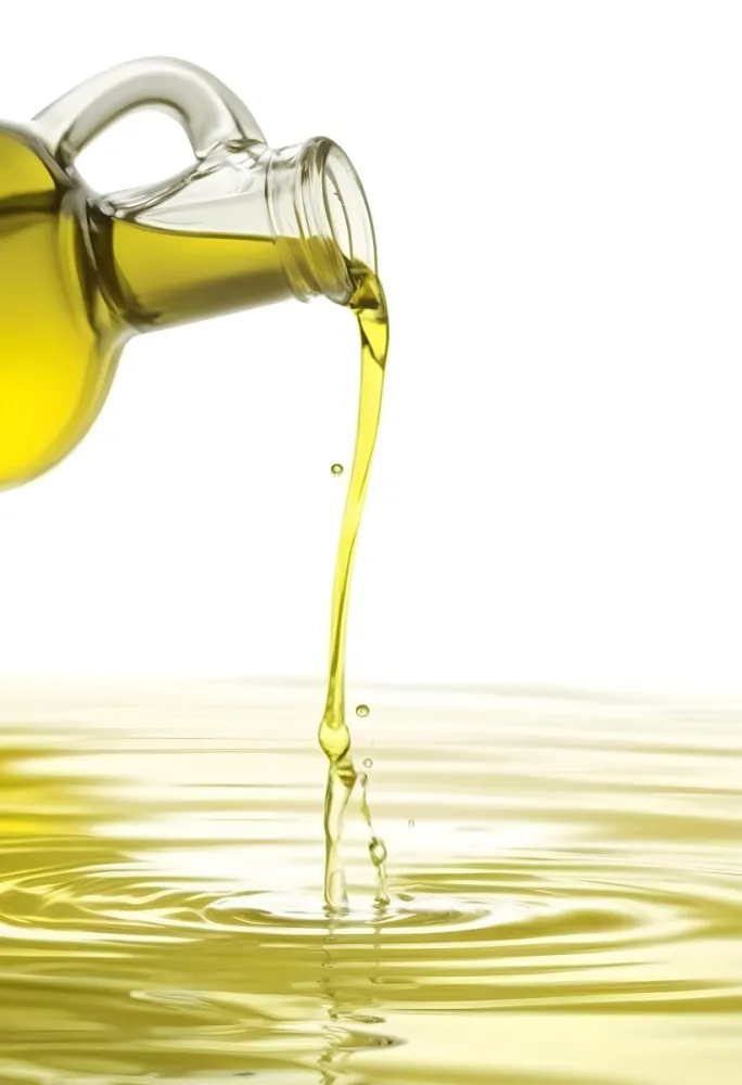 A Bottle Pouring Yellow Liquid Creating A Splash And Ripple Effect In The Water 6 67fe