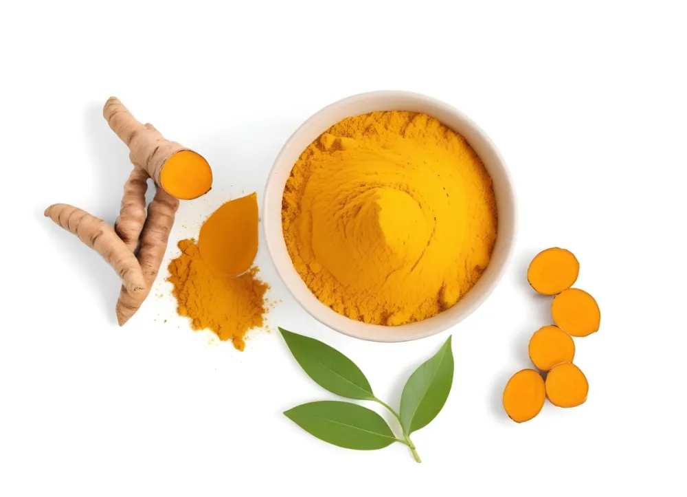 A Bowl Of Bright Yellow Turmeric Powder Surrounded By Fresh Turmeric Roots And Leaves 1 8c16