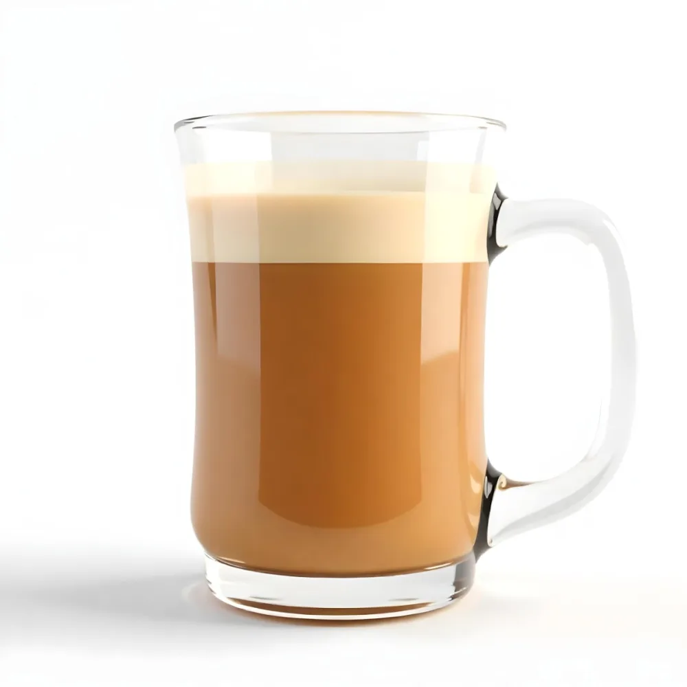 A Glass Mug Filled With A Creamy Brown Liquid Possibly Tea Or Coffee With Milk On A Plain White Background 25 C35f