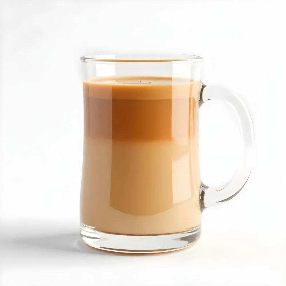 A Glass Mug Filled With A Creamy Brown Liquid Possibly Tea Or Coffee With Milk On A Plain White Background 30 88d5
