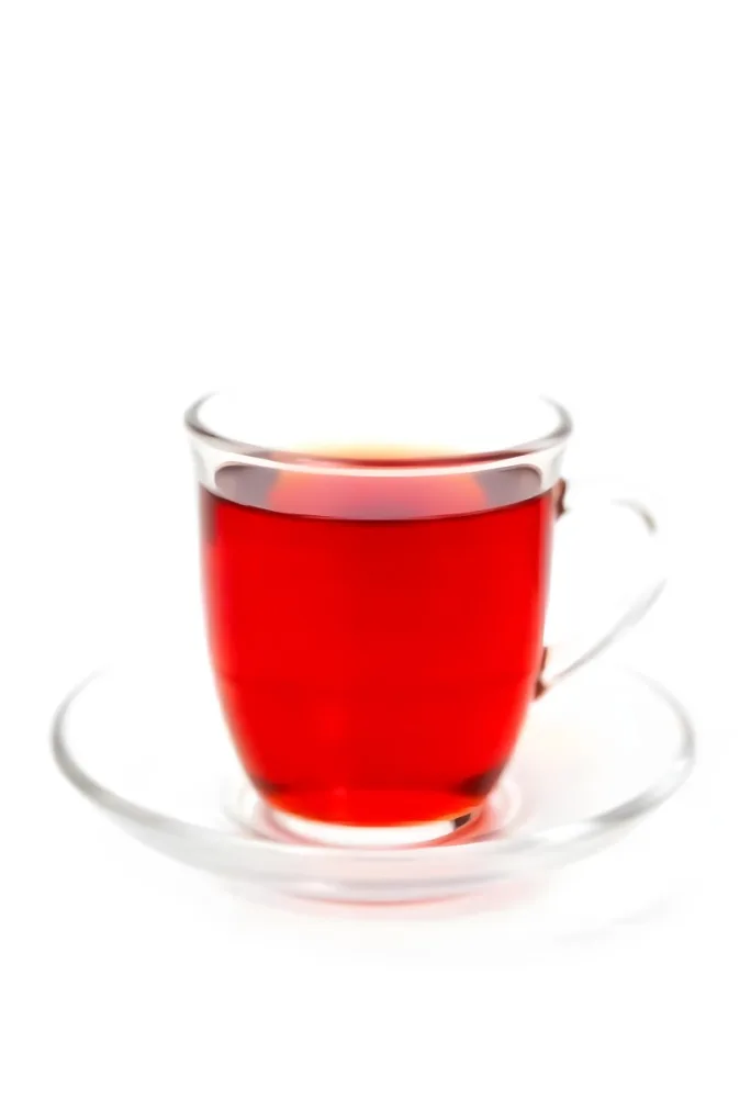 A Glass Of Red Tea On A Glass Saucer White Background 22 41ea