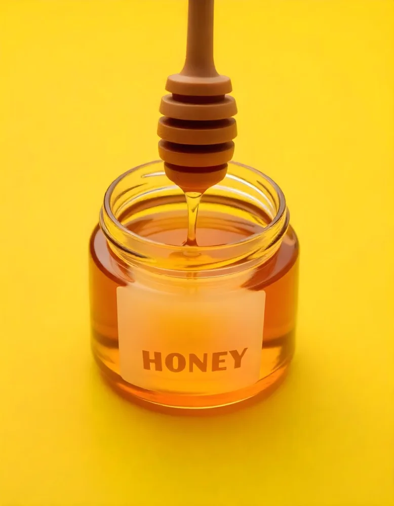 A Jar Full Of Honey With A Honey Dipper On A Yellow Background 24 C7a5